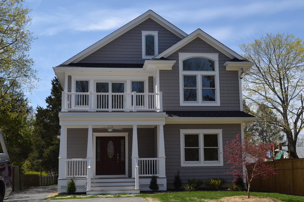 Inspiration for a mid-sized timeless gray two-story wood exterior home remodel in Huntington with a shingle roof