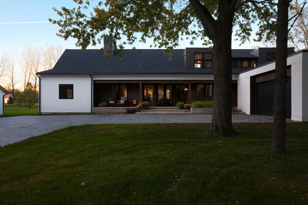 Mid-sized cottage white two-story wood exterior home idea in Indianapolis with a shingle roof