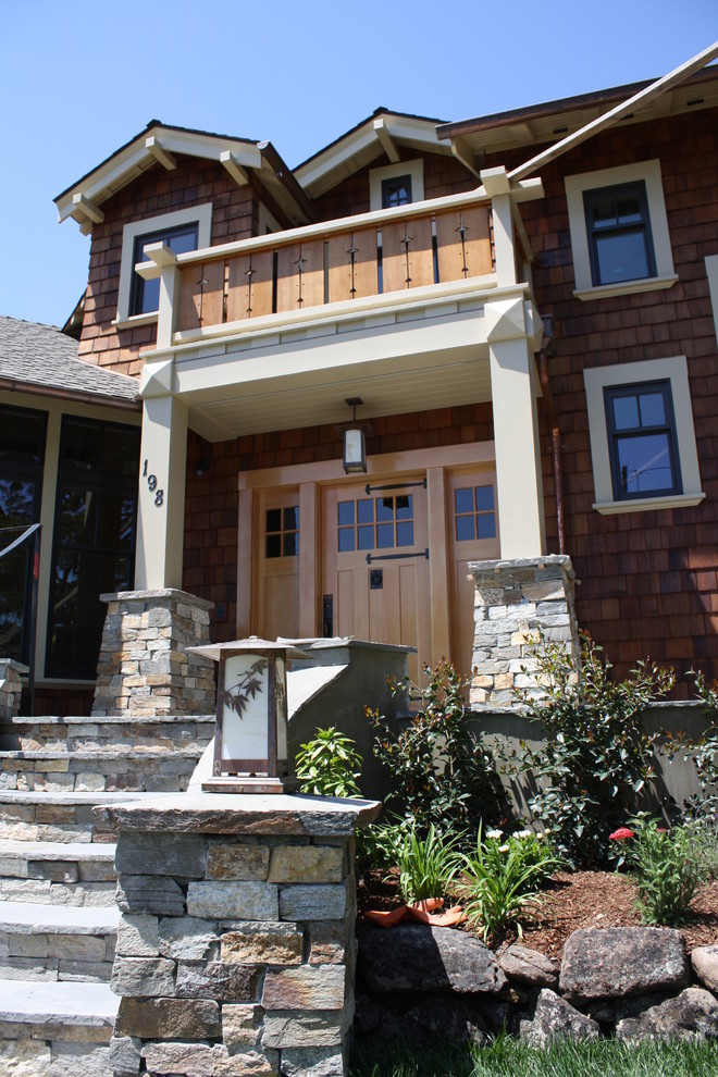 Inspiration for a large craftsman brown two-story wood house exterior remodel in San Francisco with a shingle roof