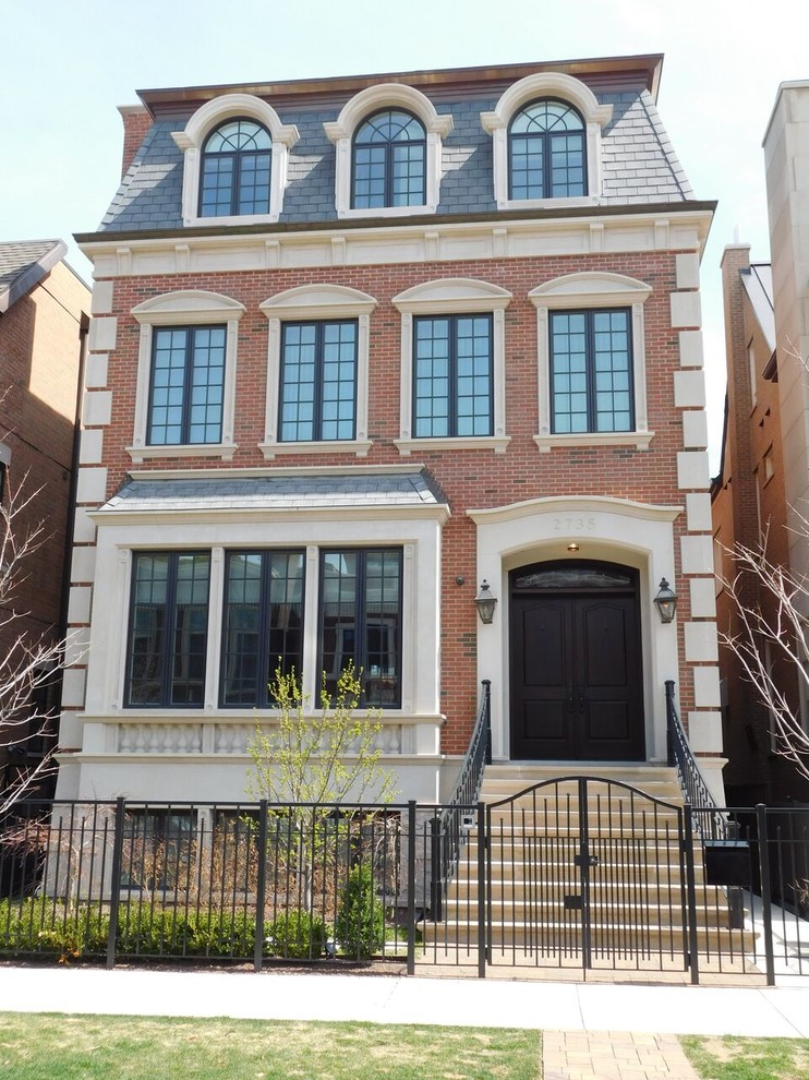 Medium sized and brown classic brick flat in Chicago with three floors, a hip roof and a shingle roof.