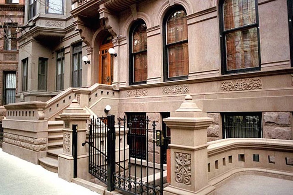Inspiration for a huge timeless beige three-story stone exterior home remodel in New York