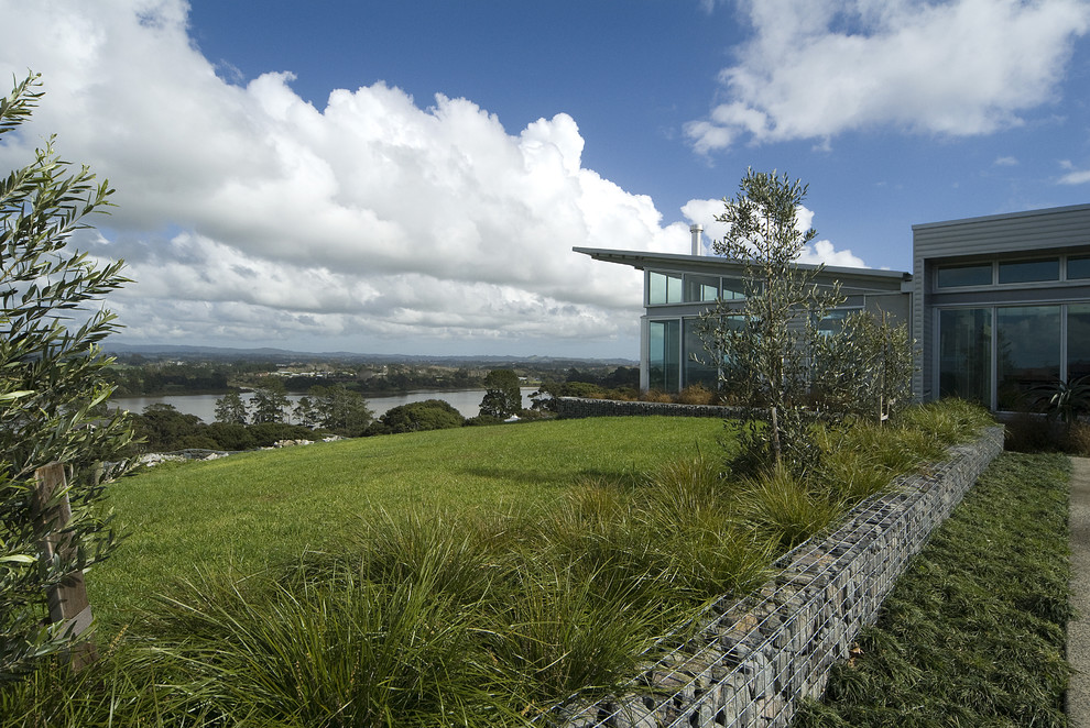 Contemporary metal exterior home idea in Auckland