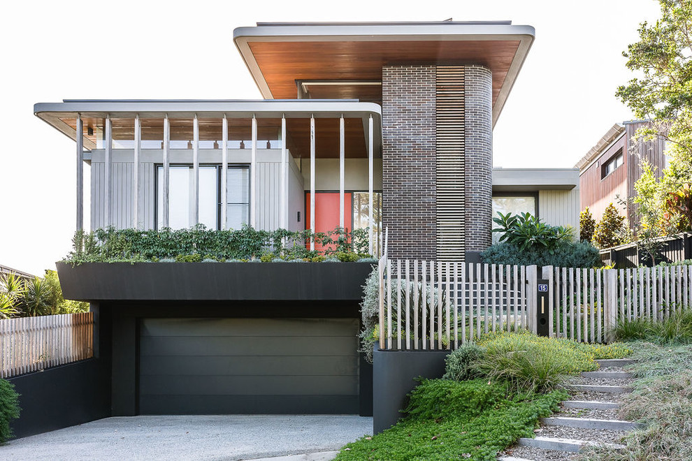 Multi-coloured contemporary detached house in Sydney with a flat roof.