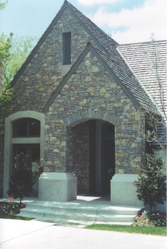 Mid-sized elegant beige two-story stone gable roof photo in Oklahoma City