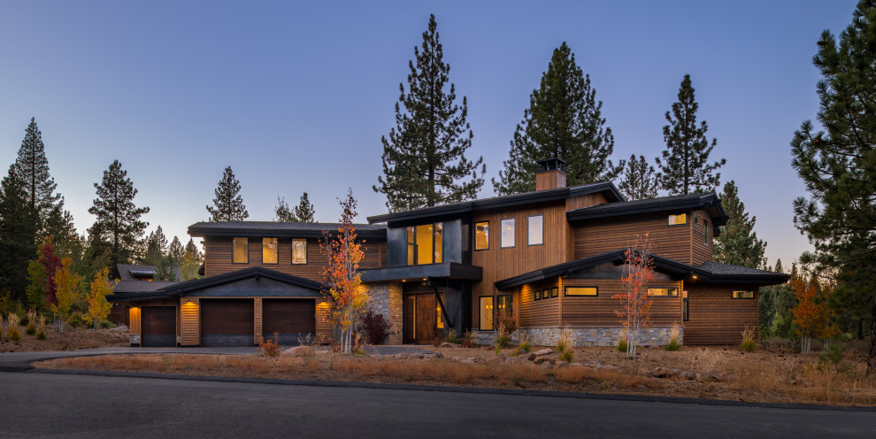 Example of a huge minimalist brown two-story wood exterior home design in Sacramento