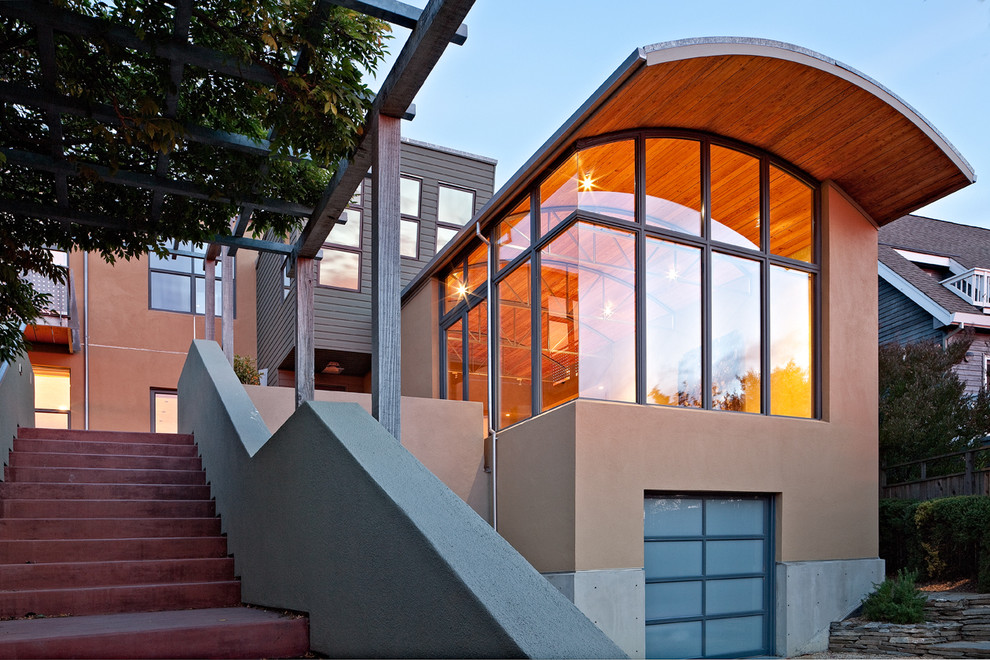 Example of a large minimalist brown two-story stucco house exterior design in San Francisco