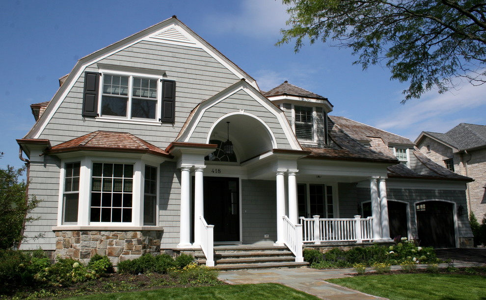 Example of a mid-sized classic gray two-story wood house exterior design in Chicago with a gambrel roof and a shingle roof
