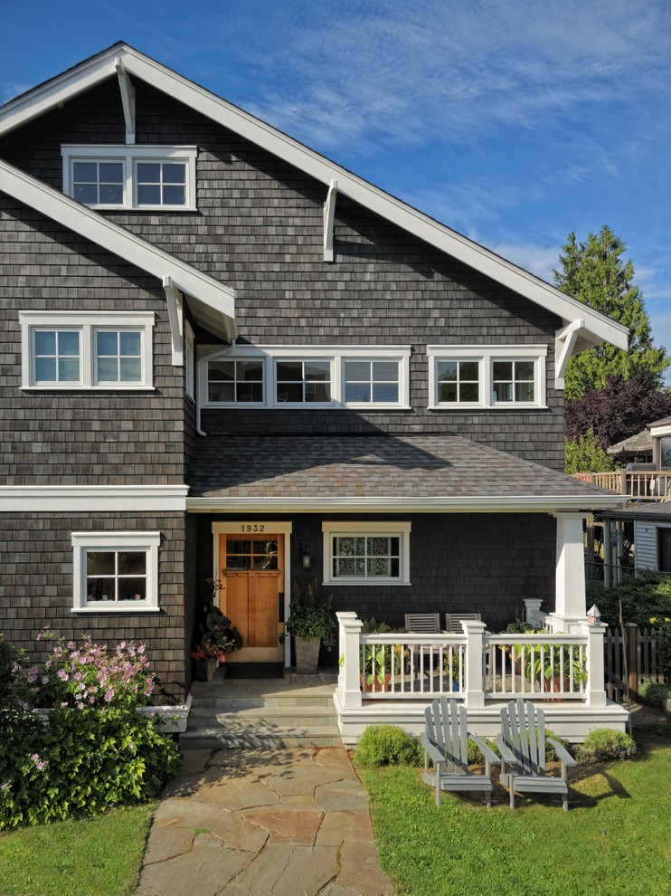 This is an example of a brown victorian house exterior in Seattle with three floors and wood cladding.