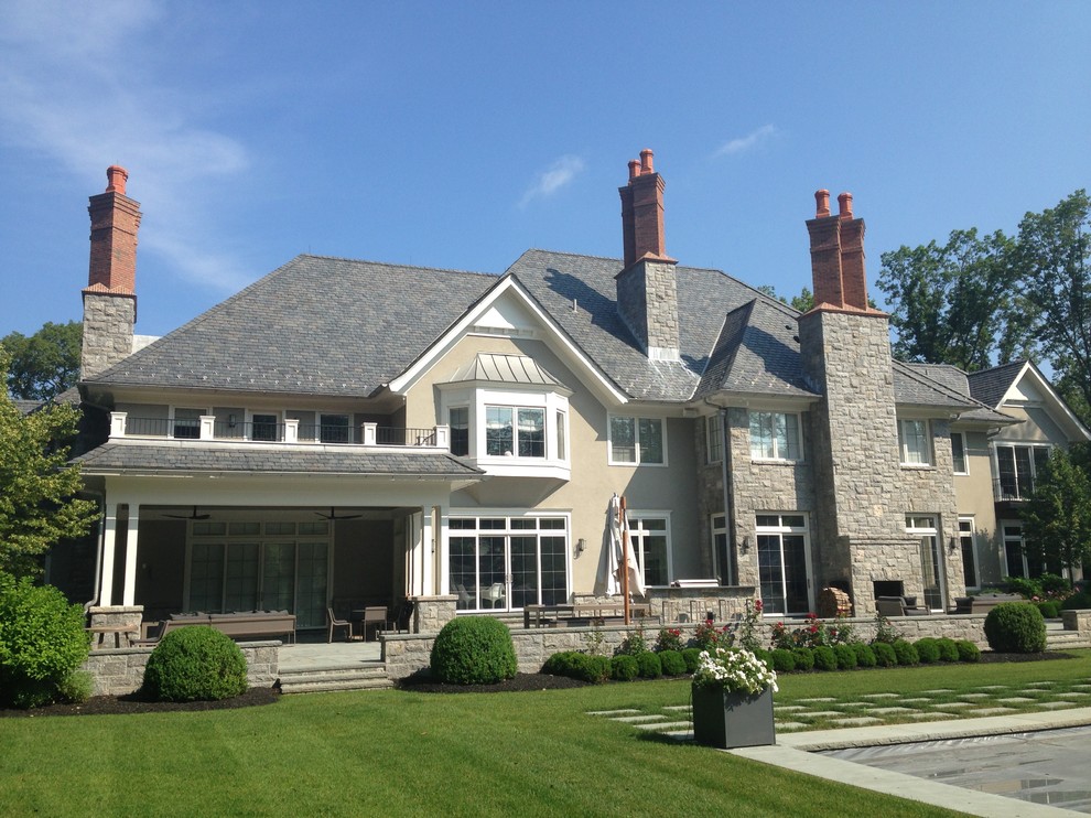 Huge elegant two-story stone exterior home photo in New York