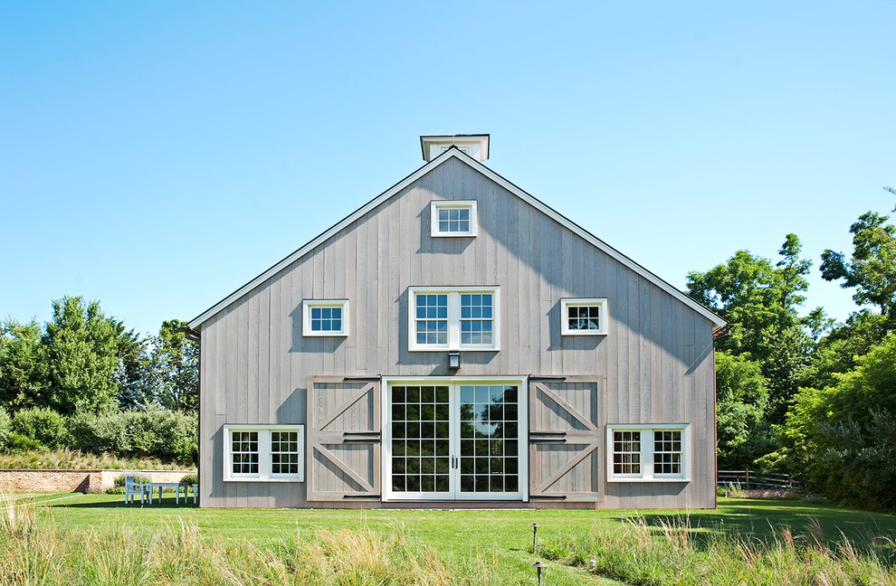 Inspiration for a large rural house exterior in New York.