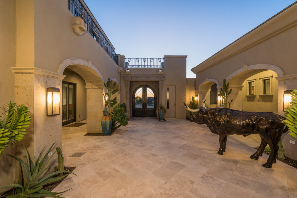 Example of a huge tuscan two-story house exterior design in Phoenix