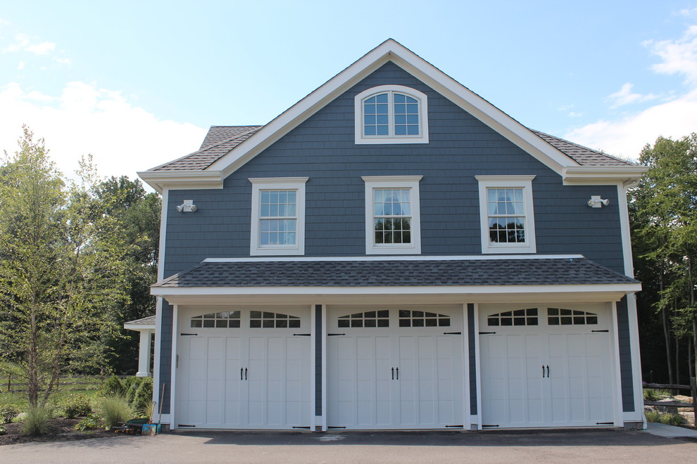 Example of a large country gray three-story wood exterior home design in New York