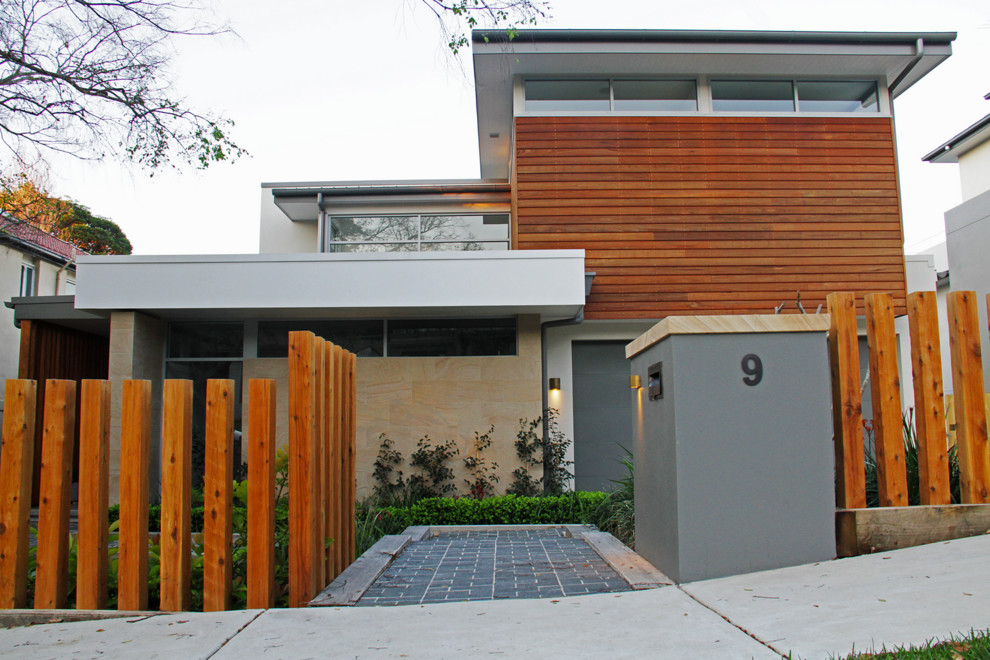 Modernes Einfamilienhaus mit Steinfassade und weißer Fassadenfarbe in Sydney