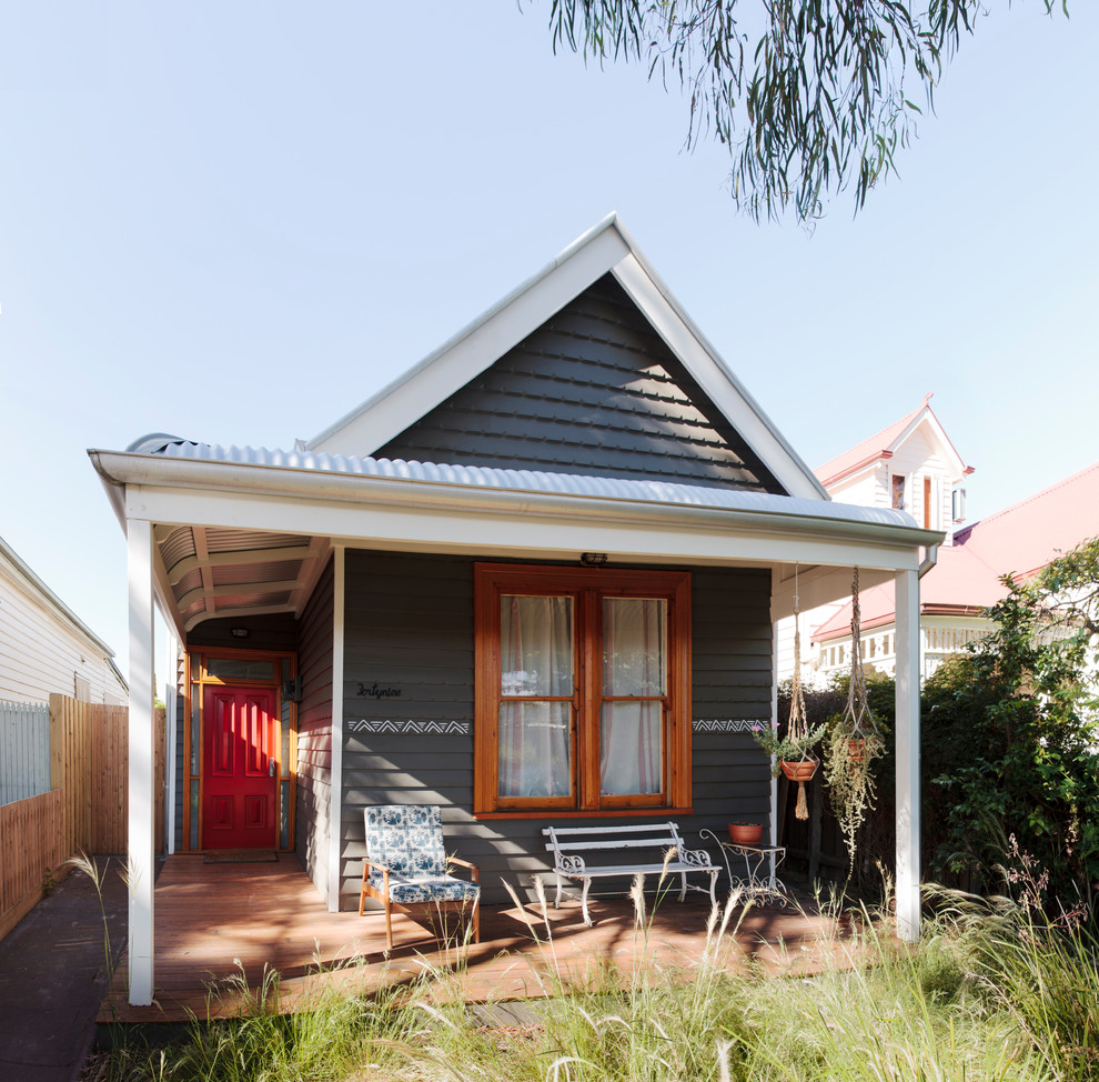 Photo of a small and gey contemporary bungalow house exterior in Newcastle - Maitland with mixed cladding and a pitched roof.