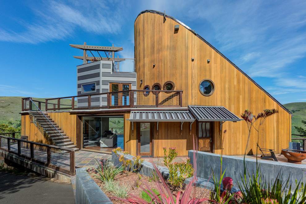 Design ideas for a large nautical detached house in San Francisco with wood cladding and a lean-to roof.