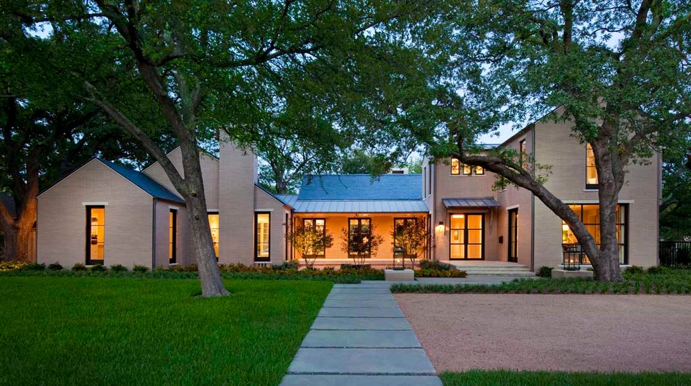 Example of a transitional beige two-story exterior home design in Dallas