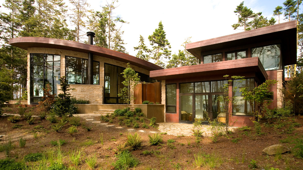 Inspiration for a contemporary stone exterior home remodel in Seattle
