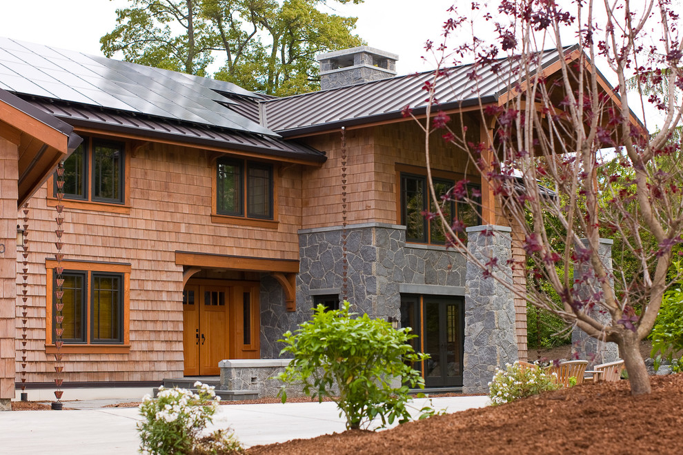 Large classic two floor house exterior in Seattle with mixed cladding and a pitched roof.