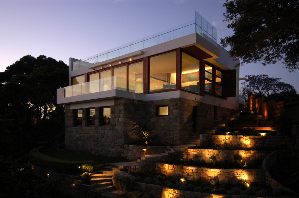 Large and white modern two floor house exterior in Sydney with stone cladding.