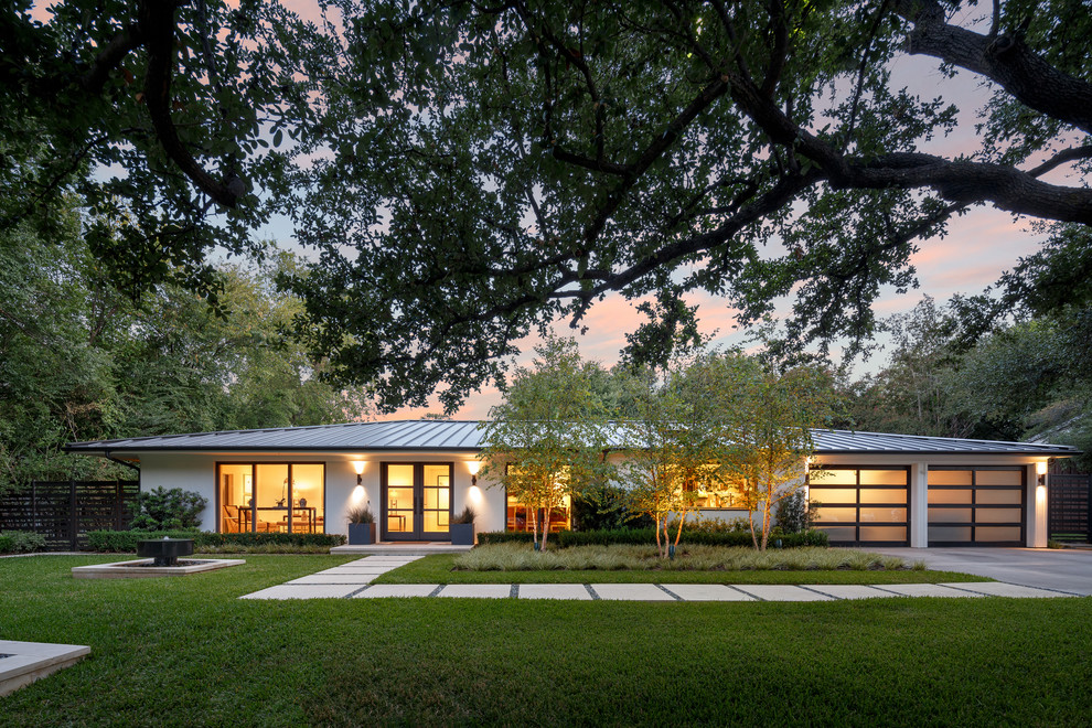 Inspiration for a white contemporary bungalow house exterior in Dallas with a hip roof.
