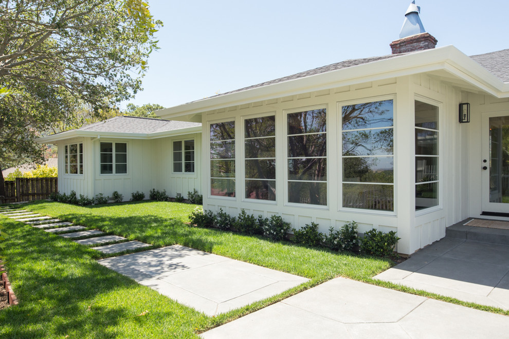 White classic bungalow house exterior in San Francisco with wood cladding.