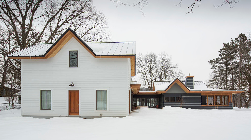 Inspiration for a traditional two floor house exterior in Minneapolis.