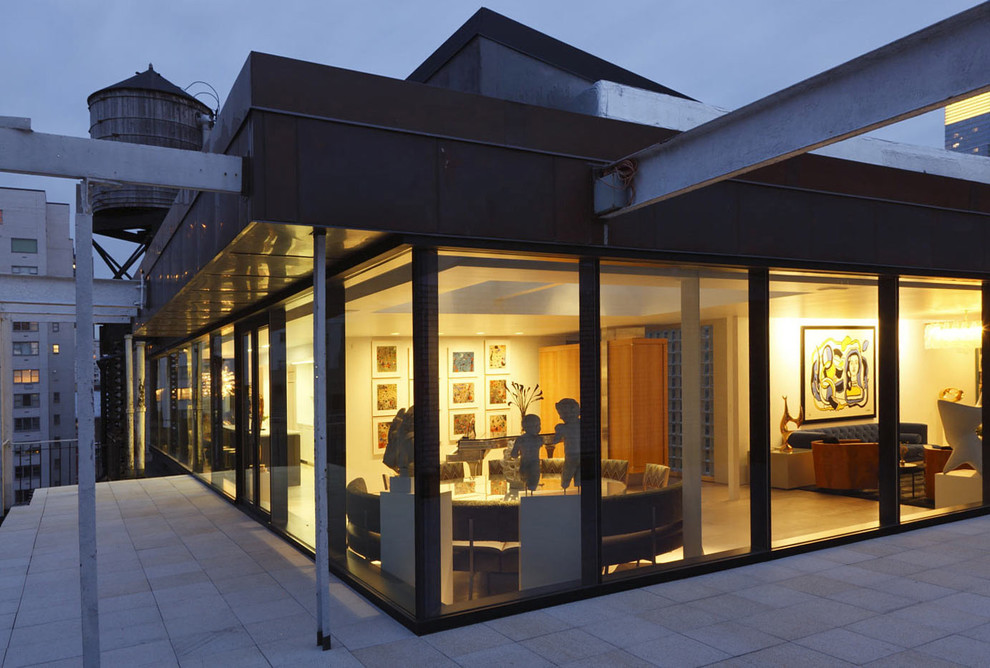 Inspiration pour une façade de maison urbaine en verre.