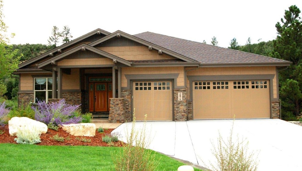 Photo of a medium sized and brown traditional bungalow house exterior in Denver with mixed cladding and a pitched roof.