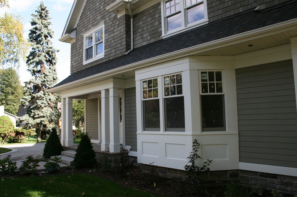 Mid-sized elegant gray two-story mixed siding exterior home photo in Toronto