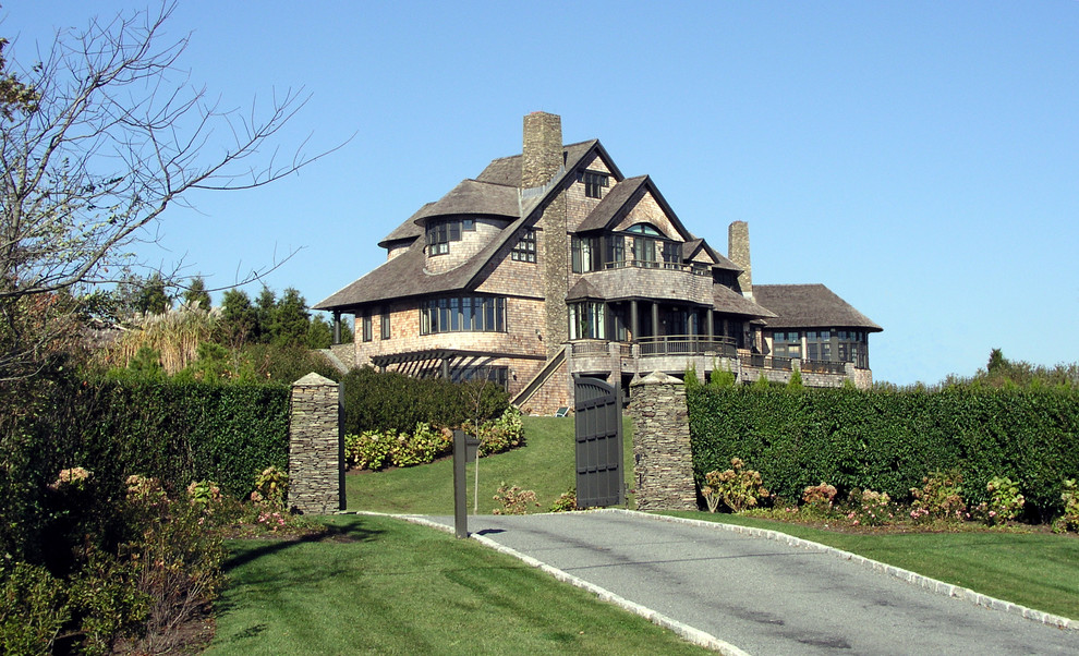 Inspiration for a victorian house exterior in Providence with stone cladding.