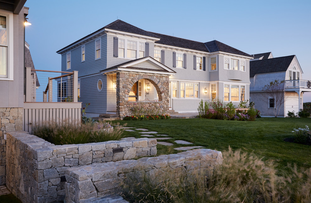 Inspiration for a coastal gray two-story wood house exterior remodel in Portland Maine with a hip roof and a shingle roof