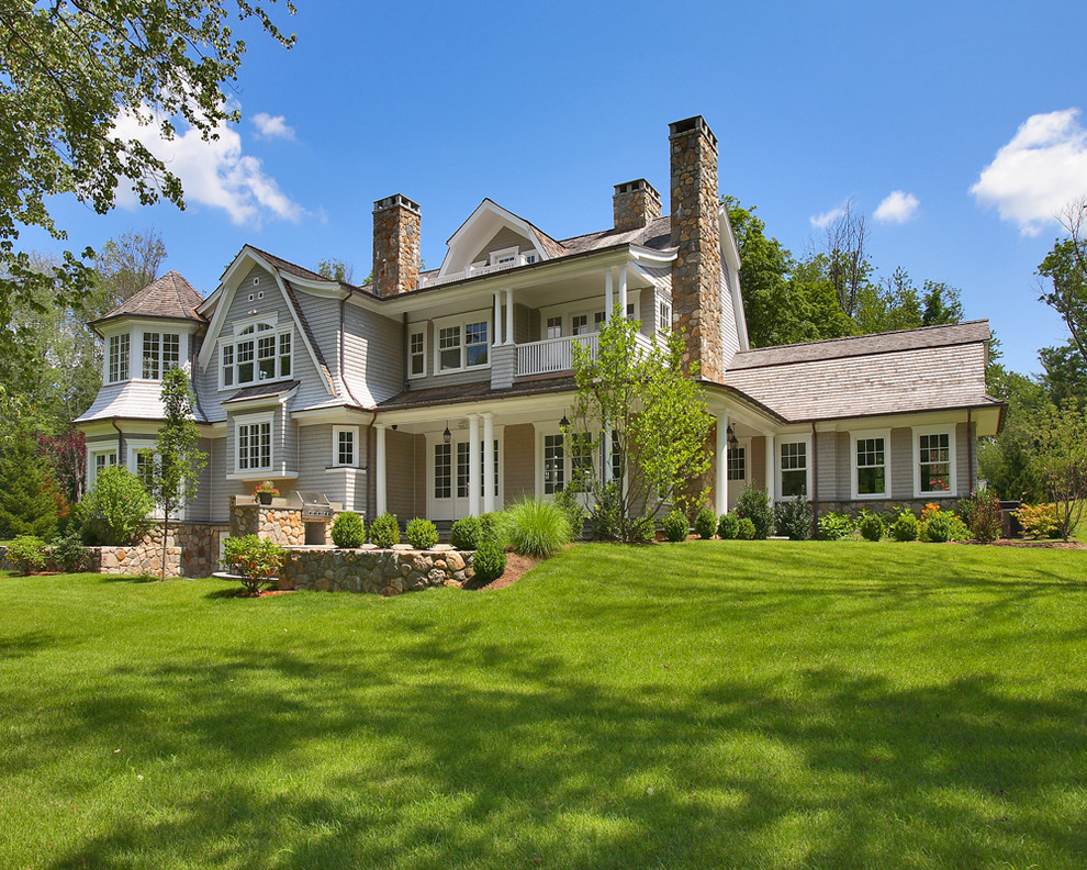 Inspiration for a timeless gray two-story wood exterior home remodel in New York with a gambrel roof and a shingle roof