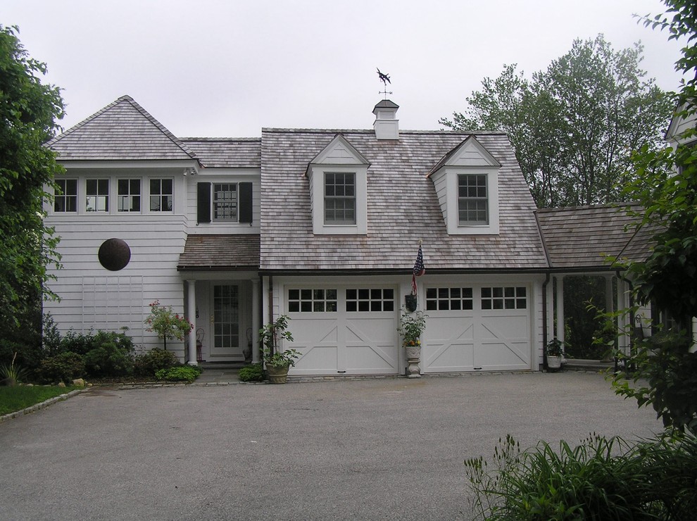Example of a small classic white two-story wood gable roof design in New York