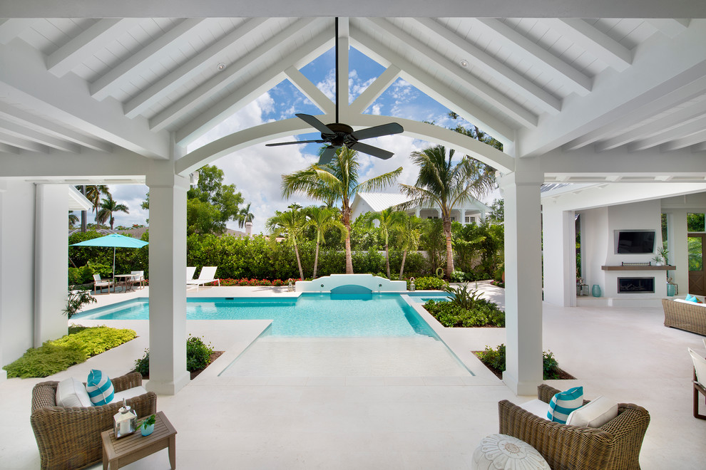 This is an example of a white beach style house exterior in Miami.