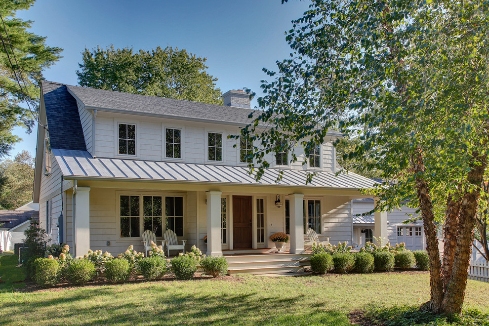 Example of a mid-sized classic white two-story wood gable roof design in Bridgeport with a mixed material roof