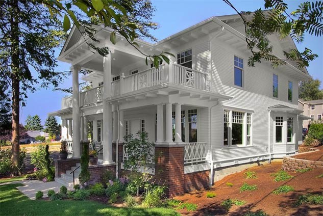 Mid-sized elegant white two-story wood exterior home photo in Seattle with a shingle roof