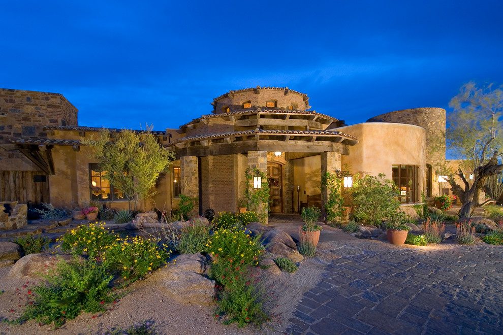 Large tuscan one-story exterior home photo in Phoenix