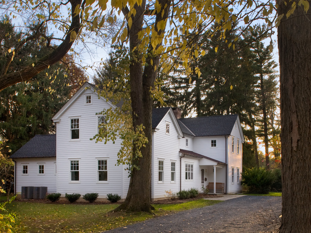 Example of a classic white wood exterior home design in New York