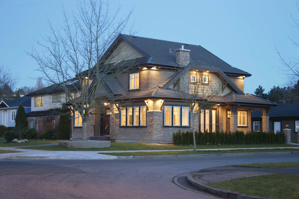 Mid-sized traditional gray two-story mixed siding exterior home idea in Vancouver with a shingle roof