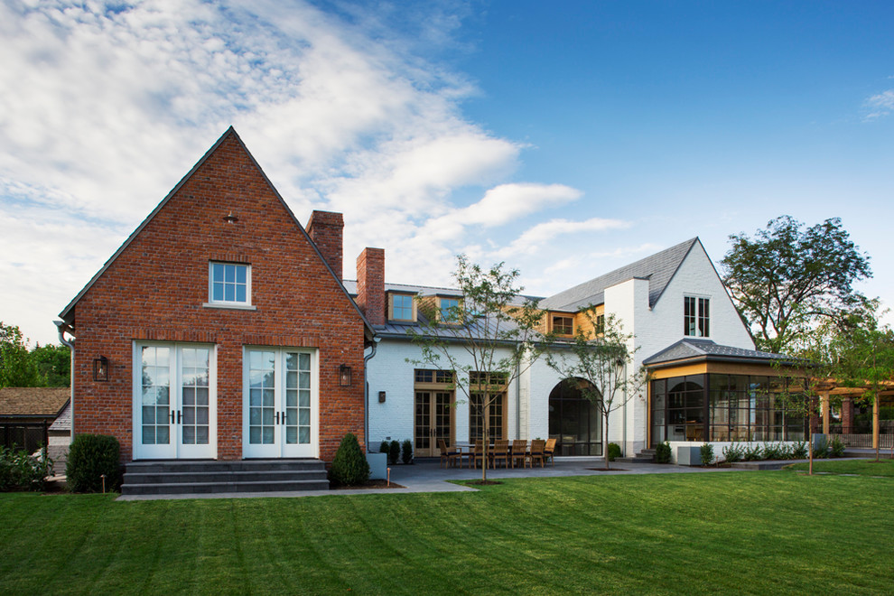 Huge traditional white two-story brick gable roof idea in Salt Lake City