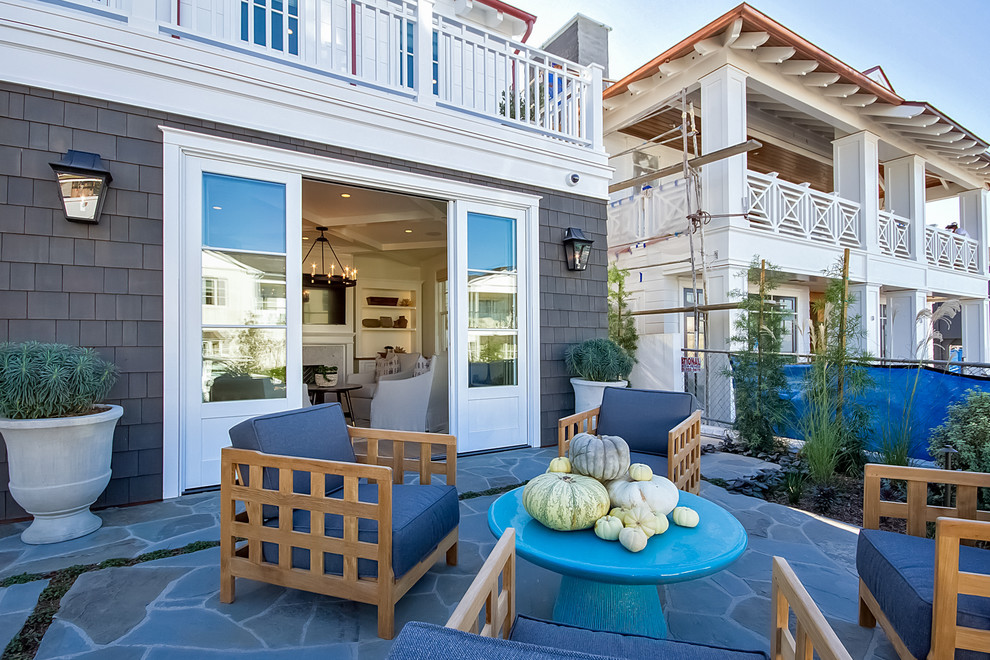 Design ideas for a beach style two floor house exterior in Orange County.