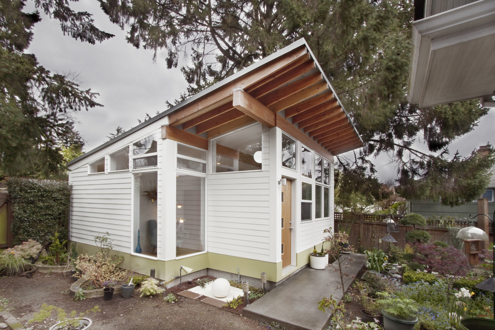 This is an example of a small contemporary bungalow house exterior in Seattle.