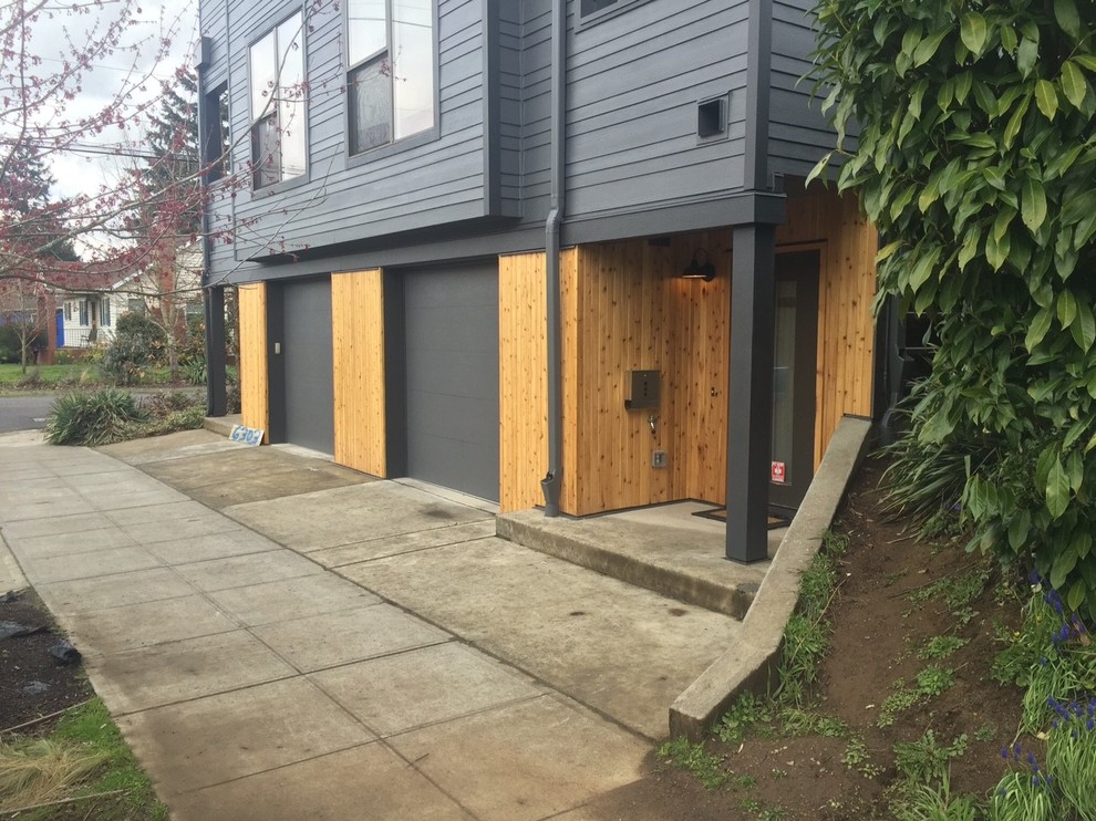 Mid-sized modern gray two-story concrete fiberboard townhouse exterior idea in Portland with a shed roof and a shingle roof