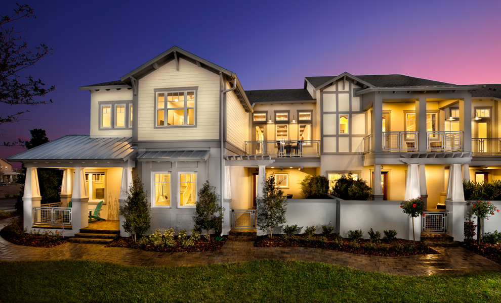 Inspiration for a mid-sized transitional white two-story wood exterior home remodel in Orlando