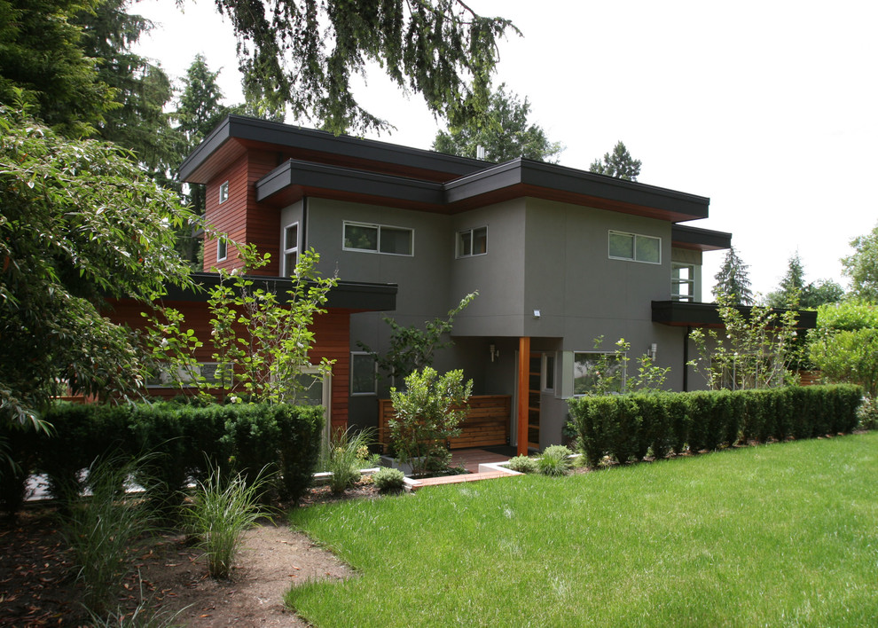 Example of a trendy wood exterior home design in Vancouver