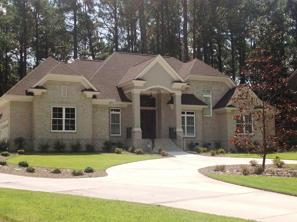 Inspiration for a medium sized and white classic two floor brick house exterior in Charlotte.