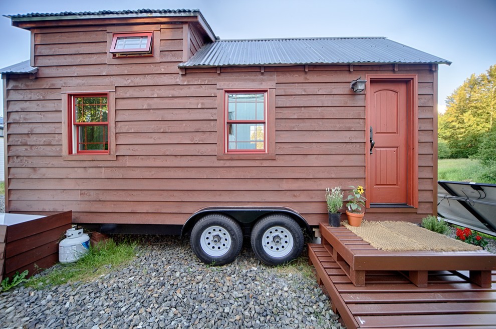 Small mountain style red tiny house photo in Seattle