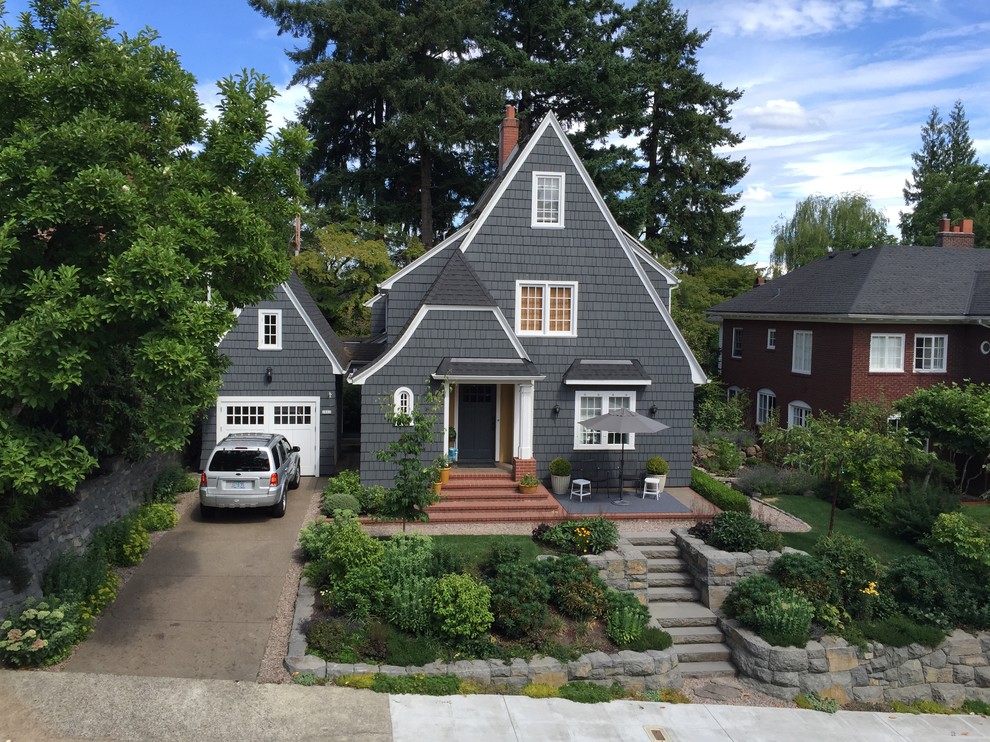 Mid-sized craftsman gray two-story wood exterior home idea in Portland with a shingle roof
