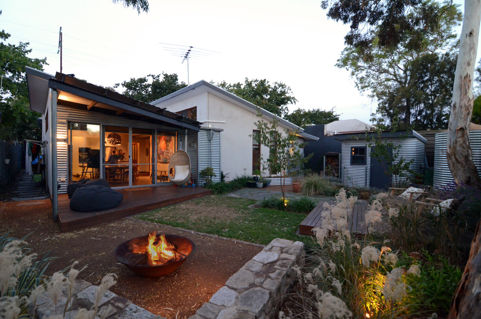 Example of an eclectic one-story exterior home design in Adelaide