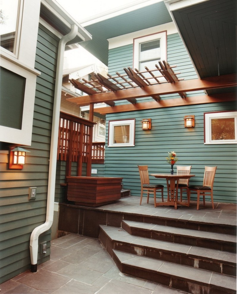 Green traditional two floor house exterior in Portland.
